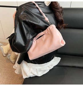 Pink glossy PU leather shoulder bag with drawstring pleats and knotted strap detail