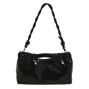 Glossy black patent leather pleated shoulder bag with unique braided rope strap and knot