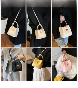Detailed views of leather bucket bags in white, black, yellow, and pink colors