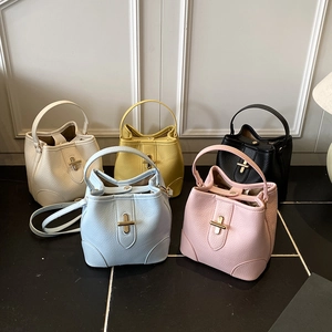 Chic cross-lock bucket bag set in five colors with textured pebble leather and top handle