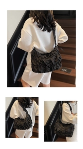 Three views showing a large black pleated shoulder bag worn with casual white outfit