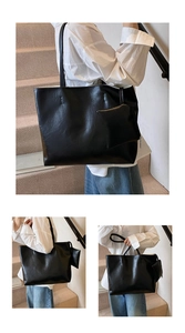 Detail of black large tote bag with glossy crackle texture and matching small pouch