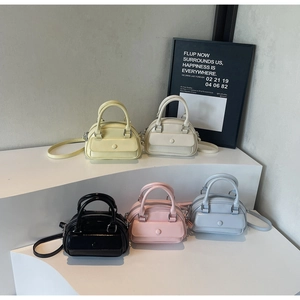 Collection of colorful glossy patent leather bowling bags in vibrant summer shades