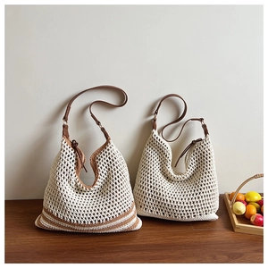 Detail of handmade woven tote bags with leather straps and rustic bohemian textures