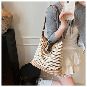 French style woven tote bag with hollow grid design and brown leather straps