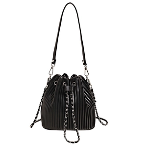 Minimalist black pleated bucket bag with silver chain drawstring and thin leather strap