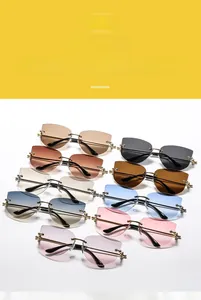 Détails de lunettes de soleil œil de chat sans monture avec perles sur les branches