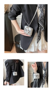 Mini silver bucket bag detail with lychee texture and heart charm chain detail