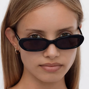 Retro black narrow oval sunglasses with vintage cat eye frame for a stylish hip hop look