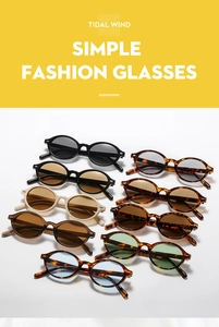 Close-up of retro oval sunglasses in black, beige, and tortoiseshell frame colors