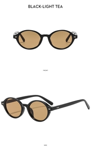 Detail view of oval sunglasses with silver studs in black frame and light tea lenses