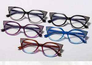 Detail of cateye sunglasses showing glitter frame finish and various color options