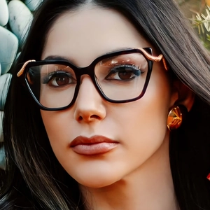 Fashionable square black eyewear frames with golden wave accents and tortoise shell edges
