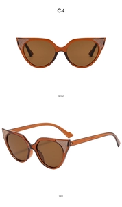 Macro view of transparent amber cateye frame with glitter accents and dark brown lenses