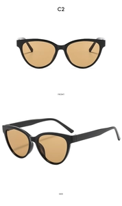 Detailed front and side view of cat-eye sunglasses with black frame and amber lenses