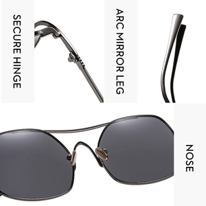 Detail view of reinforced metal hinges and curved mirror legs on oversized sunglasses