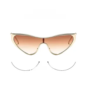 Detail of gold metal cat-eye sunglasses with brown gradient lenses and sleek frame