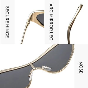 Detail view of gold metal sunglasses with secure hinge and curved mirror legs