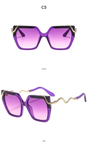 Detail of square purple gradient sunglasses with gold snake-shaped metal temples