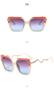 Detail view of square sunglasses featuring snake-shaped temples and gradient lenses