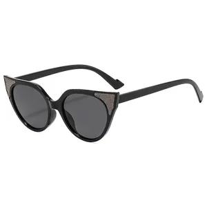 Classic black cat-eye sunglasses for women with silver glitter accents and dark lenses