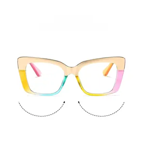 Detailed close-up of square cat-eye frame with rainbow gradient and gold metal accents
