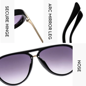 Detail of aviator sunglasses with purple gradient lenses and secure golden metal hinges