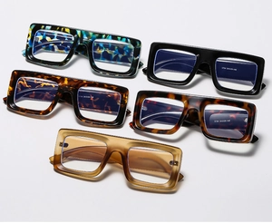 Close-up of stylish square eyewear frames in tortoiseshell and solid colors