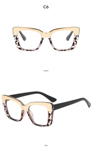 Detailed front and side view of cat-eye glasses with gold metal and tortoise frame