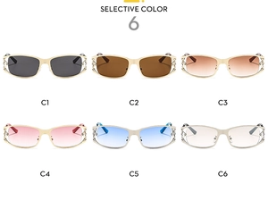 Detailed view of six vintage Y2K sunglasses with hollowed-out metal frames and colorful lenses