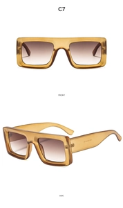 Detail view of square tortoiseshell sunglasses with brown gradient lenses and wide temples