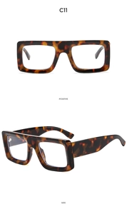 Close-up of vintage square tortoiseshell sunglasses with thick frames from side and front view