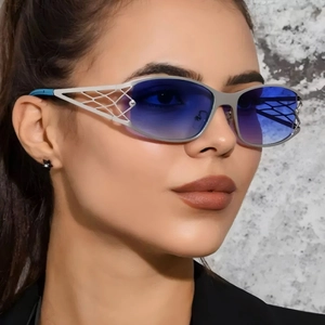 Y2K futuristic hollow metal sunglasses with gradient blue lenses on model portrait