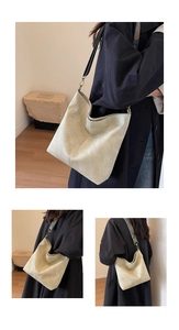 Detail of hobo shoulder bag with a colorful jacquard wide strap and khaki suede texture