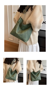 Detail of vintage green tote bag featuring an ethnic pattern woven wide shoulder strap