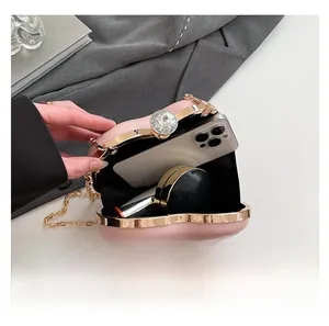 Pink heart-shaped evening clutch bag interior showing space for phone and makeup