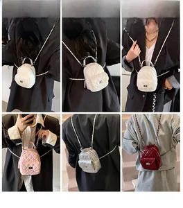 Quilted mini backpack with chain straps shown in white, pink, silver and red variants