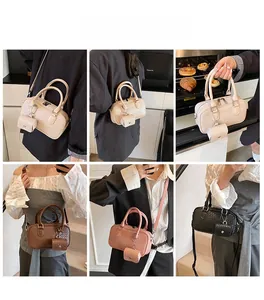 Detailed view of women wearing the woven texture crossbody bag with mini coin purse