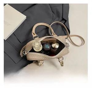 Internal view of the beige woven texture bag showing high capacity for daily items