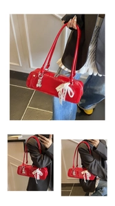 Stylish red patent leather baguette shoulder bag with white lace bow detail for daily wear.