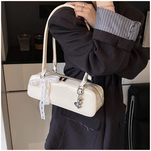 Elegant white patent leather shoulder bag with chic lace bow and heart charm for women