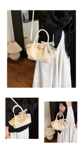 Detailed close-up of cream textured leather tote bag with lace bow and metal buckle