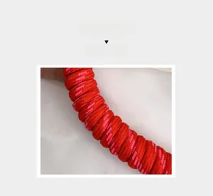 Detail of red and pink woven nylon rope with high-density spiral braided texture