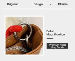 Detail view of silver metal buckles and woven rope handles on the brown tote bag