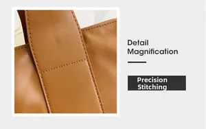 Detail magnification showing precision stitching on brown leather large tote bag