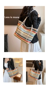 Detail of colorful striped woven tote bag featuring silver PU shoulder straps and buckles