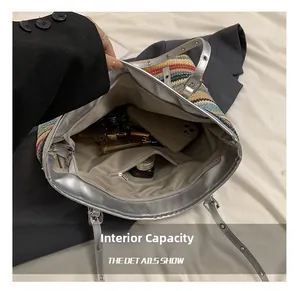 Interior view of striped straw tote bag showing large capacity with silver lining