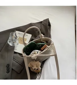 Top view of woven bucket bag interior showing capacity for phones and lipstick