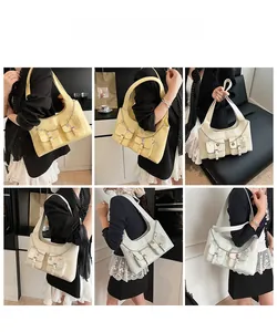 Detailed views of vintage oil wax leather tote bag with pockets and metal heart chain charms
