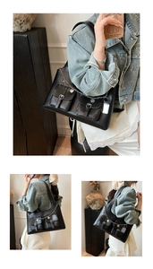 Detail of black faux leather tote with silver charms and double front pockets